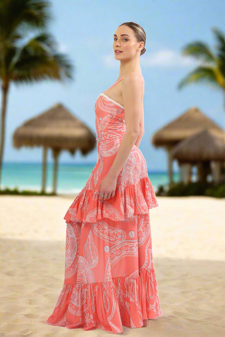 Luxury coral paisley French Riviera Cover Up with ruffle details on beach.