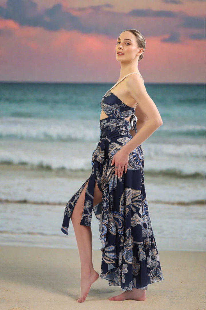 Montecarlo Cover-Up in navy and gold print, luxury beachwear with wrap design.