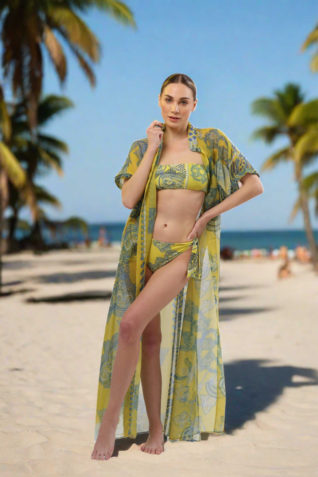 Sheer yellow and blue print Monaco Kimono cover-up worn on a beach.