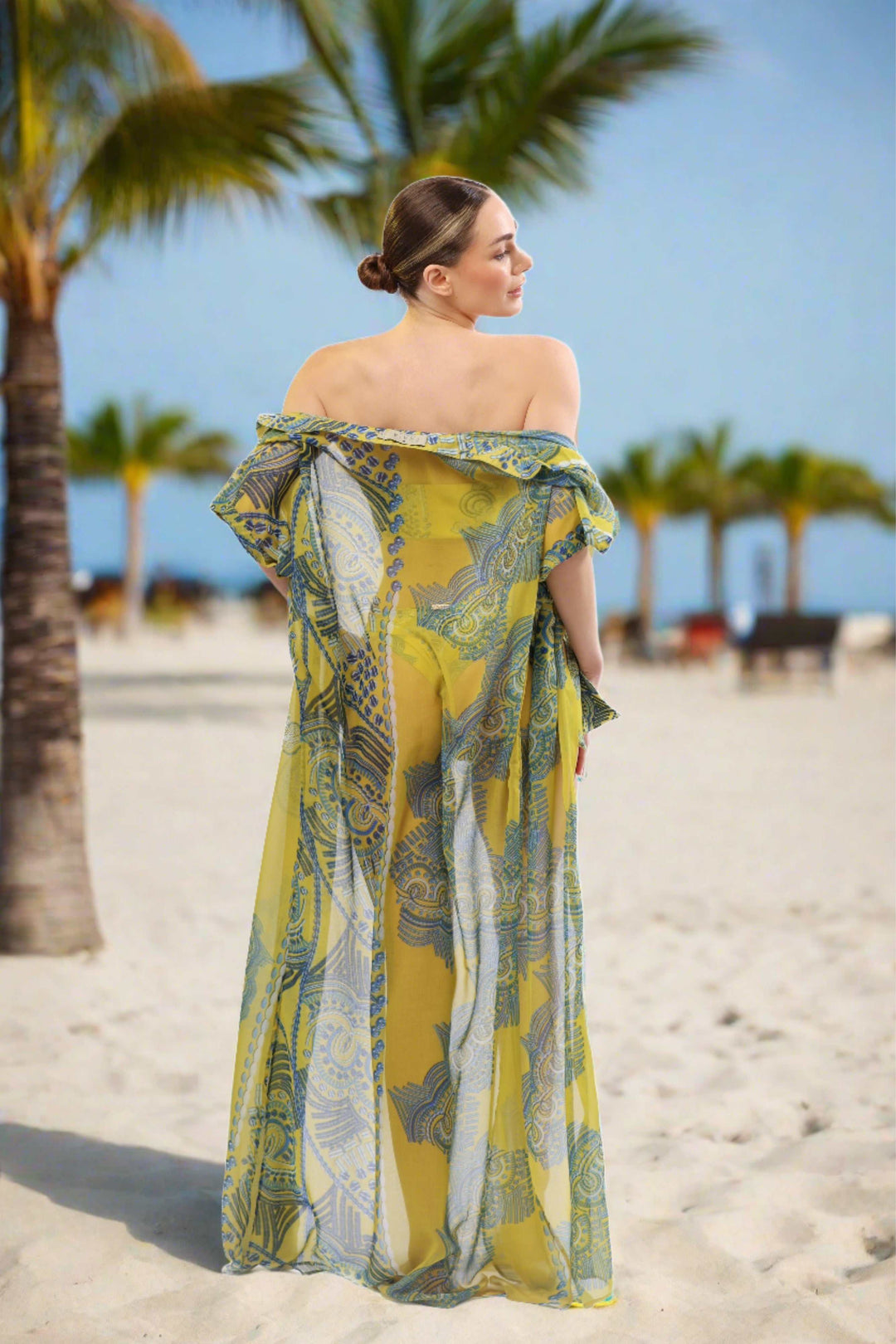 Monaco Kimono sheer maxi cover-up in yellow and blue print on beach.
