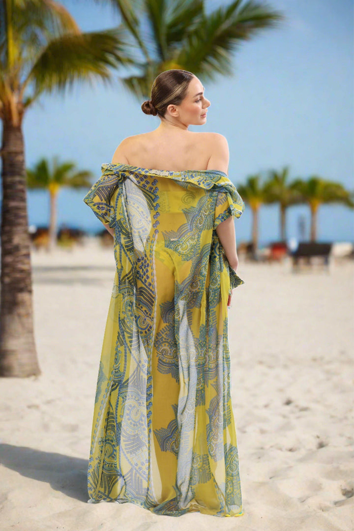 Monaco Kimono sheer maxi cover-up in yellow and blue print on beach.