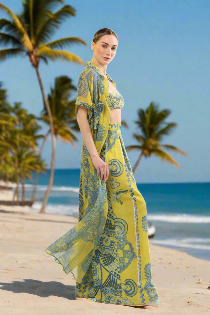 Monaco Kimono sheer maxi cover-up in yellow and blue print on a beach.