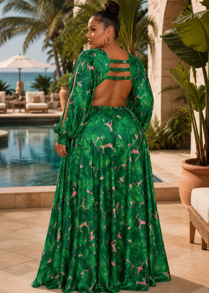 Back view of the Dania Plus tropical cut out bodysuit long sleeve maxi dress featuring an open back with decorative straps and flowing maxi overlay at a luxury resort.