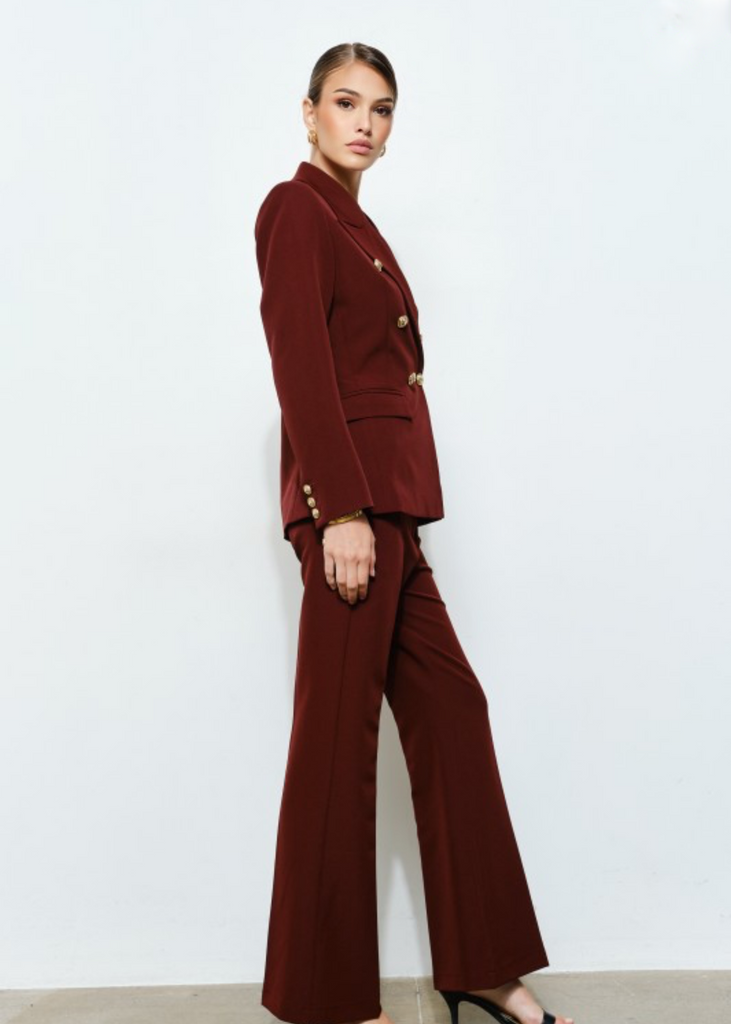 Professional tailored burgundy blazer with gold button details and matching trousers, modern executive outfit