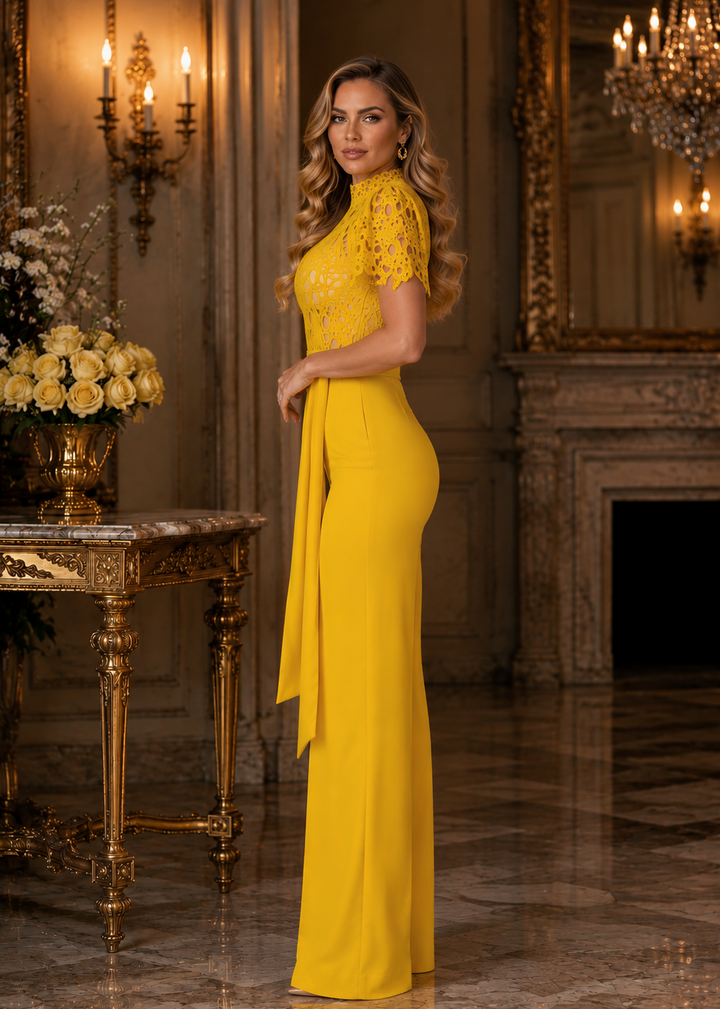 Side view of the Janet Yellow Lace High-Neck Wide-Leg Jumpsuit showcasing the elegant silhouette, lace bodice, statement sleeves, and flowing wide-leg design in a luxury editorial environment.