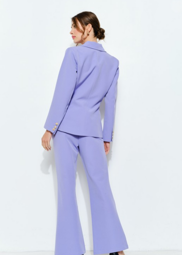  Woman wearing a lavender double-breasted blazer with gold buttons and matching wide-leg trousers, full front view, luxury business suit.