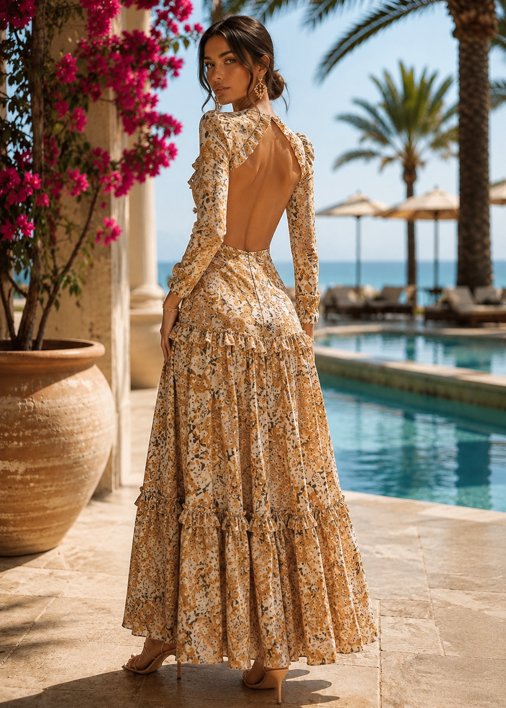 Back view of the MALAYSIA fall floral print maxi dress showcasing the dramatic open-back design, long sleeves, ruffled waist detail, and elegant flowing maxi skirt.