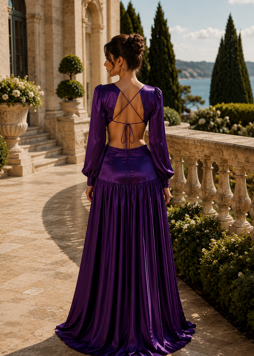Back view of the Mykonos Purple Amethyst satin cut out maxi dress featuring an elegant open back with long sleeves at a luxury Mediterranean estate.