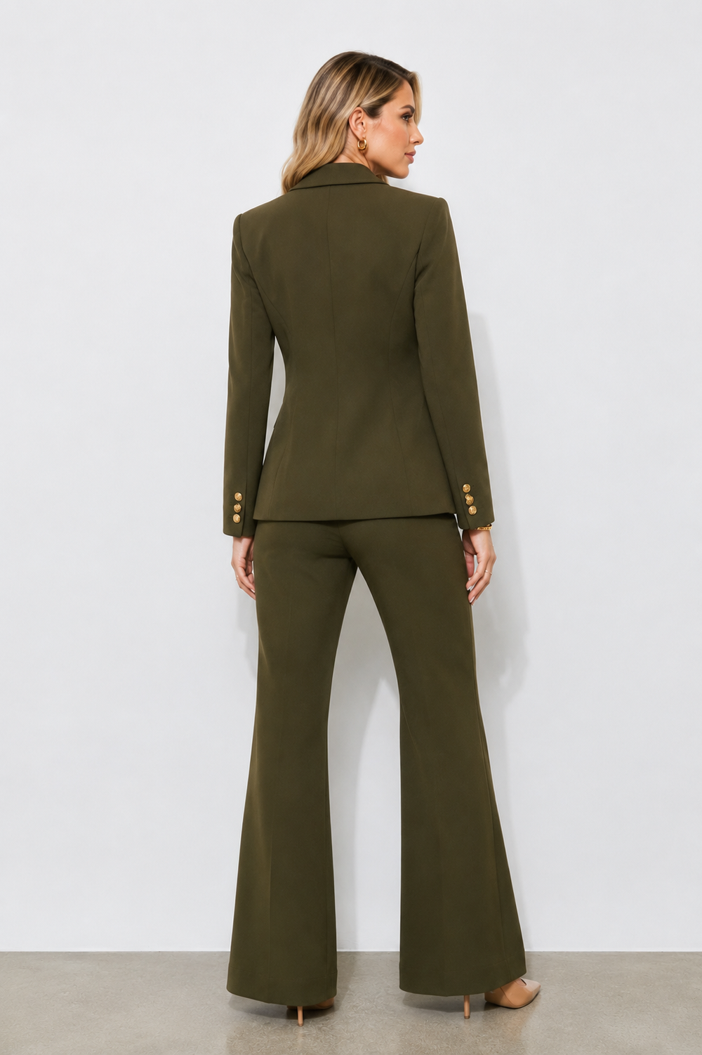 
Back view of the Olive Prestige Icon Two-Piece Suit showcasing the structured tailored blazer and elegant olive green wide-leg trousers.

