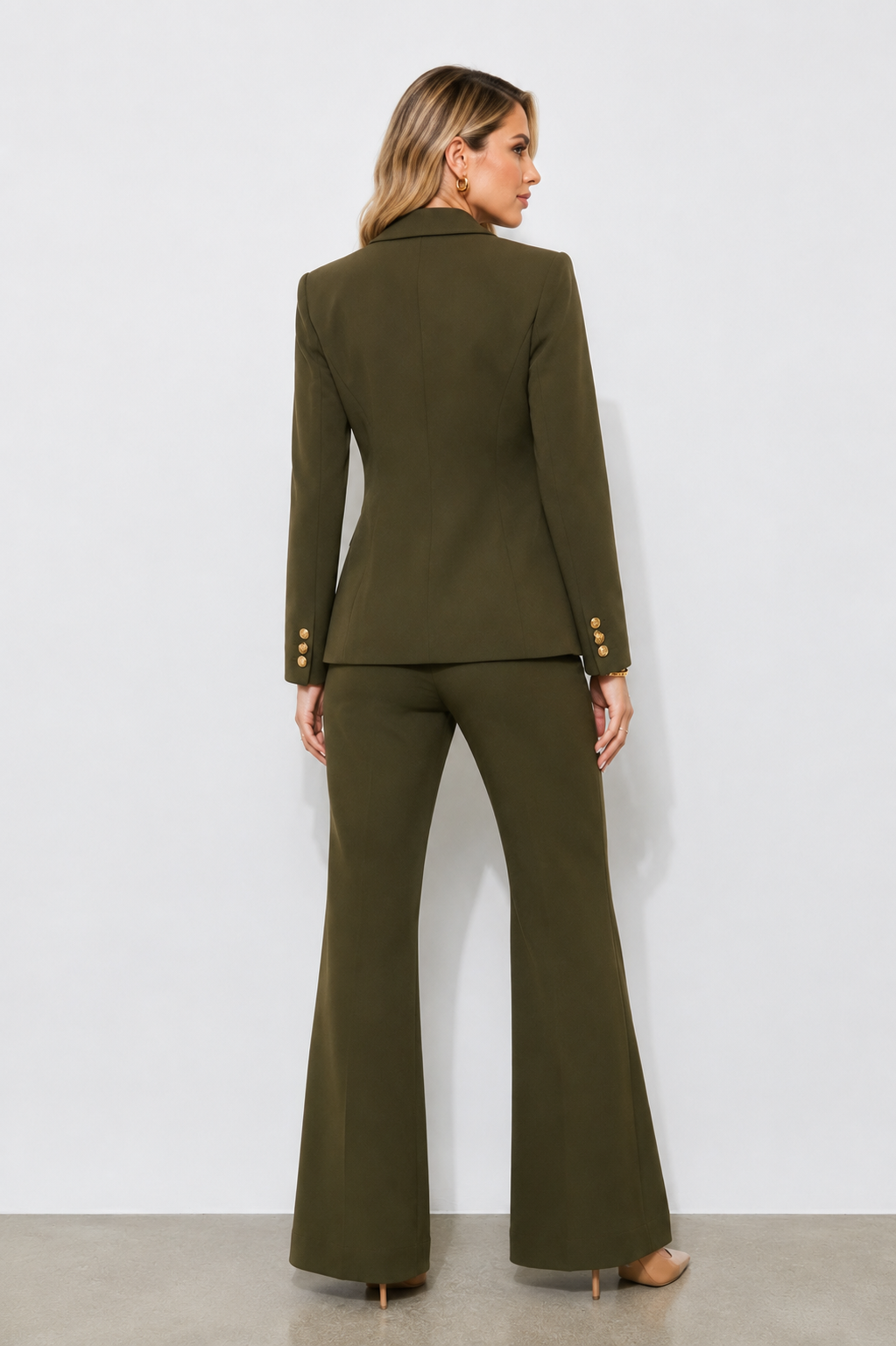 
Back view of the Olive Prestige Icon Two-Piece Suit showcasing the structured tailored blazer and elegant olive green wide-leg trousers.
