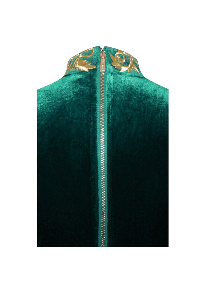 Emerald green velvet gown with an elegant zipper detail.